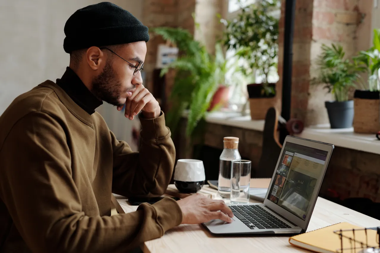 A freelancer working on a laptop at a desk